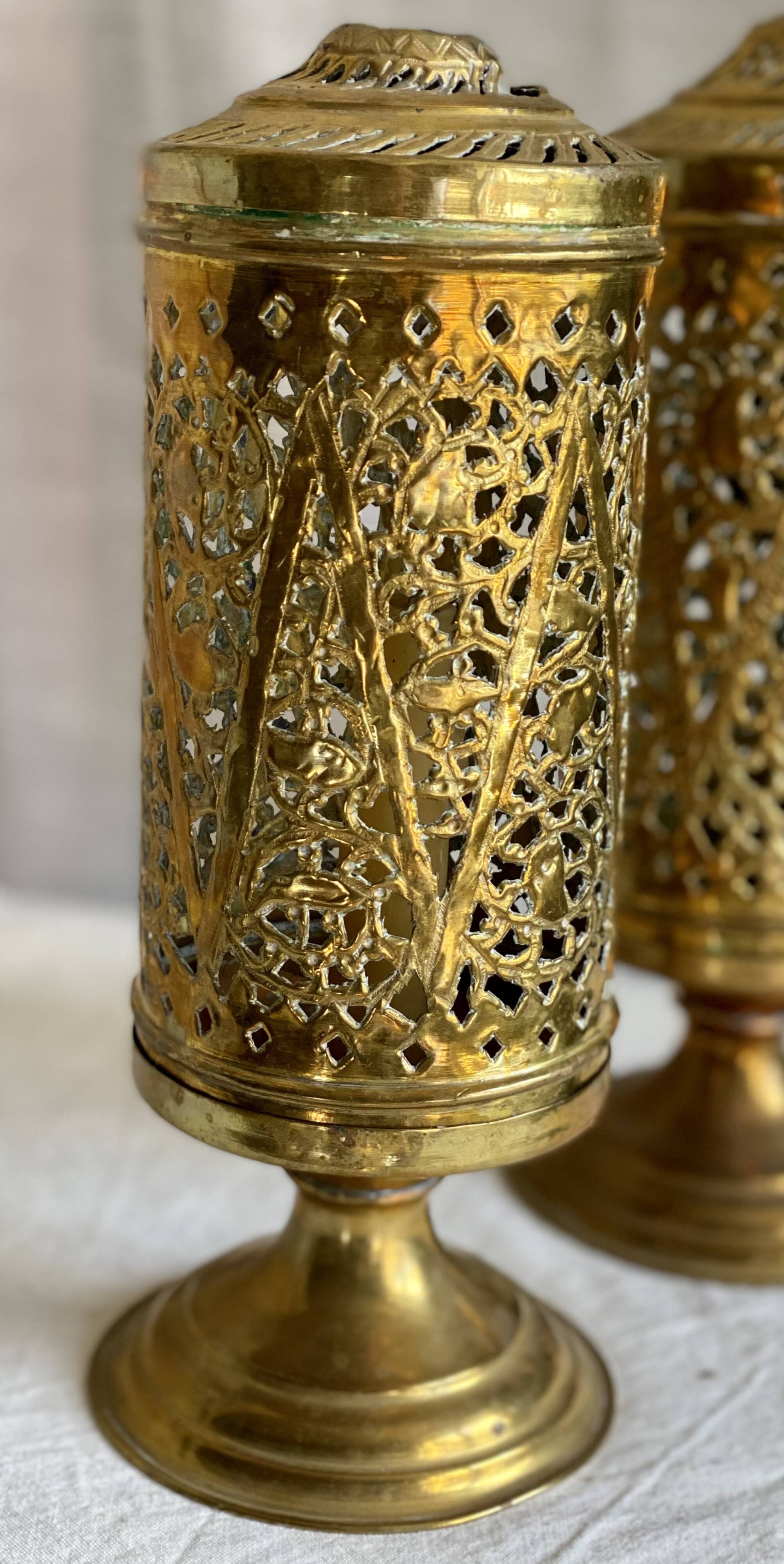 Pair of vintage openwork copper tealight candle holders