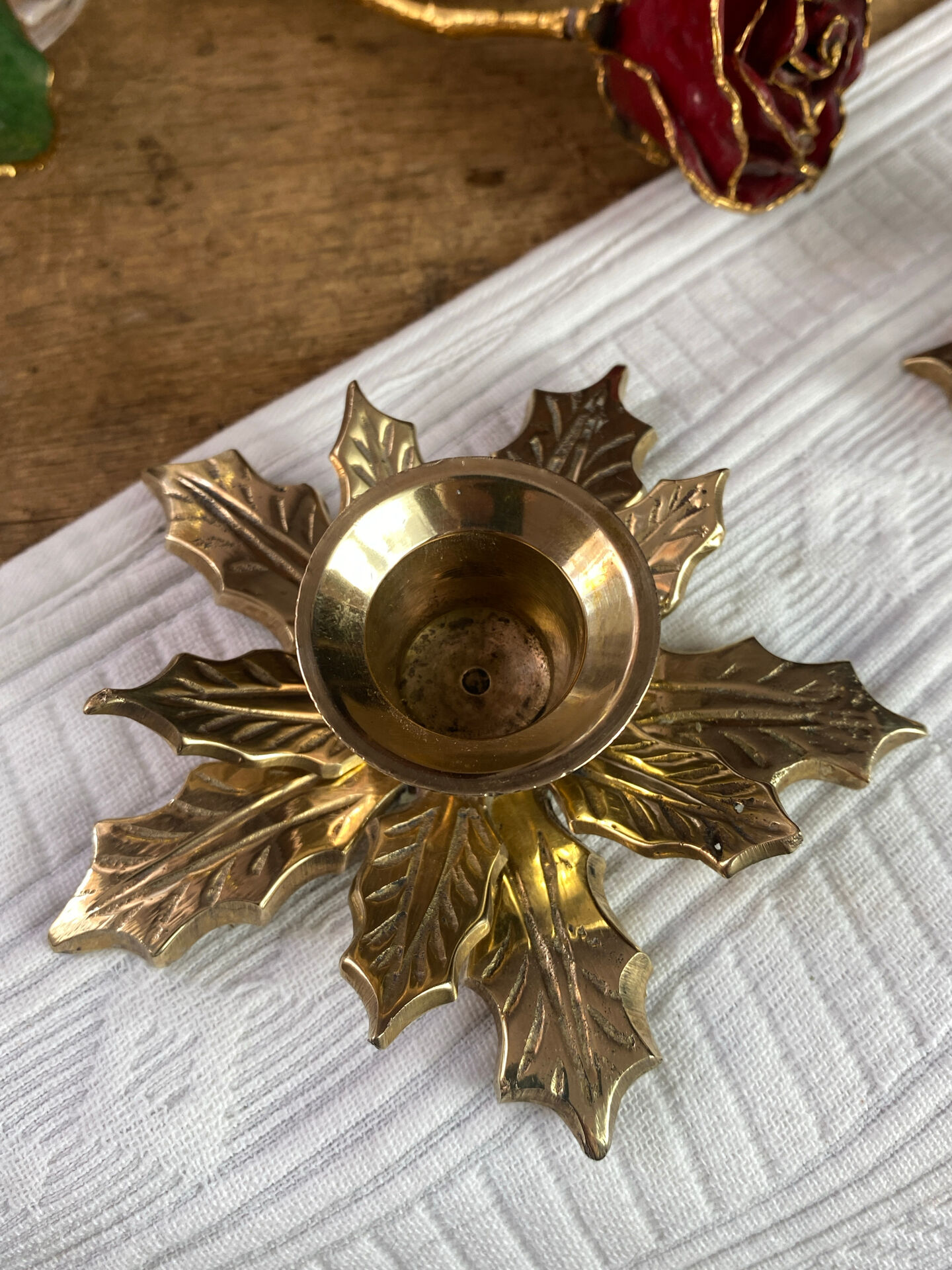 Pair of candlesticks, holly leaves, in brass