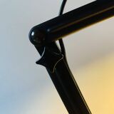 Old articulated desk lamp in red metal