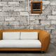 Canapé vintage en rotin design 1970 tissu bouclette écru