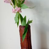 Japanese vase made of woven bamboo. Ikebana