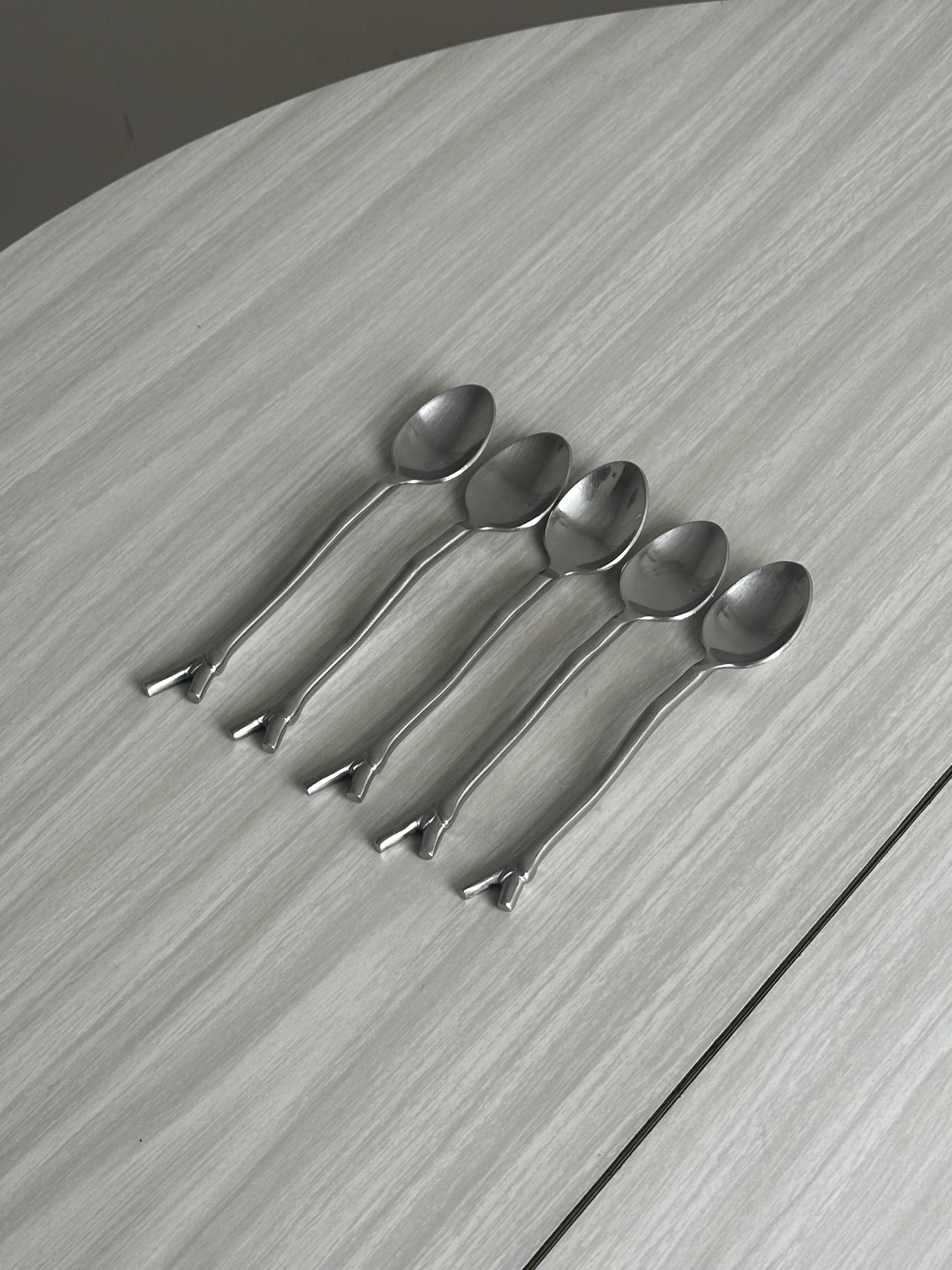 5 small silver metal spoons