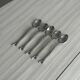 5 small silver metal spoons