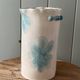 Stoneware vase decorated with flowers in a watercolour style.