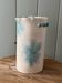 Stoneware vase decorated with flowers in a watercolour style.