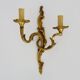 Antique double-light bronze wall light with acanthus leaves. 1950s