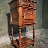 Antique French bedside table with a marble top.