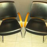 Chairs in leather, walnut and chrome