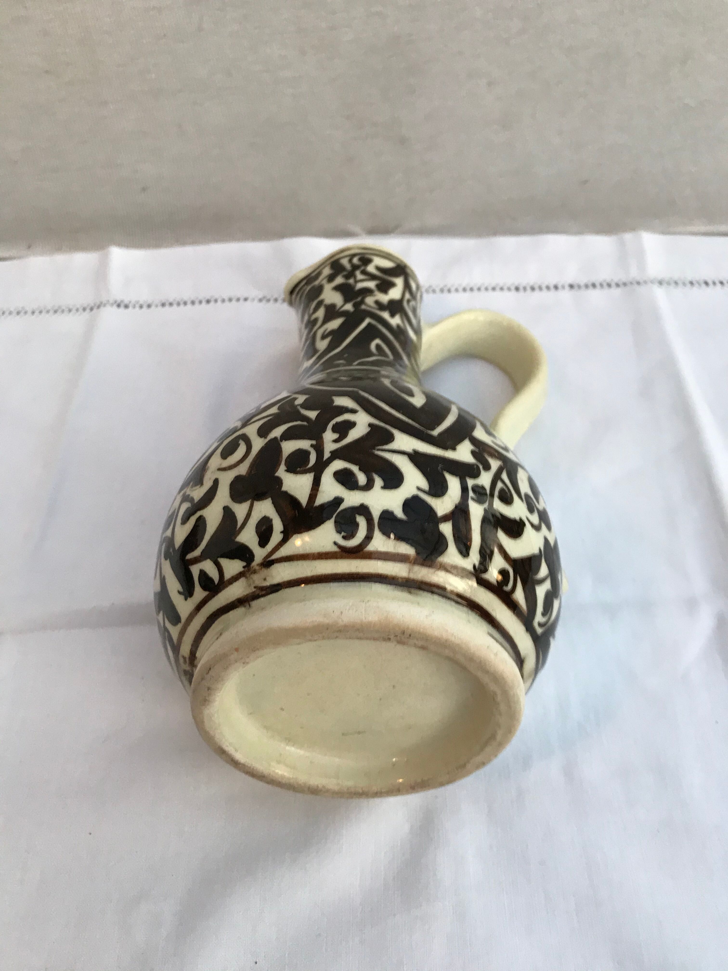 Former beige cracked ceramic pitcher