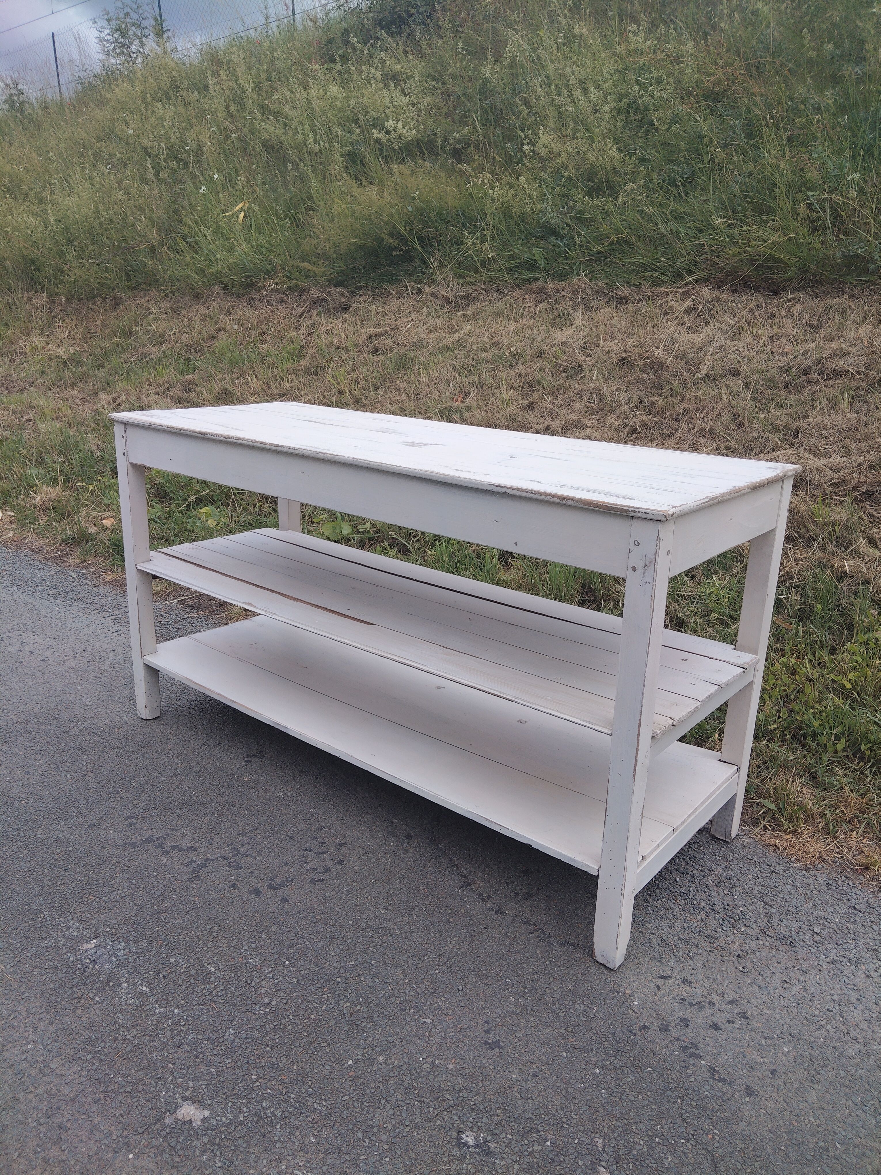 Antique white patinated draper's table, florist's wooden console.