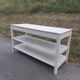Antique white patinated draper's table, florist's wooden console.