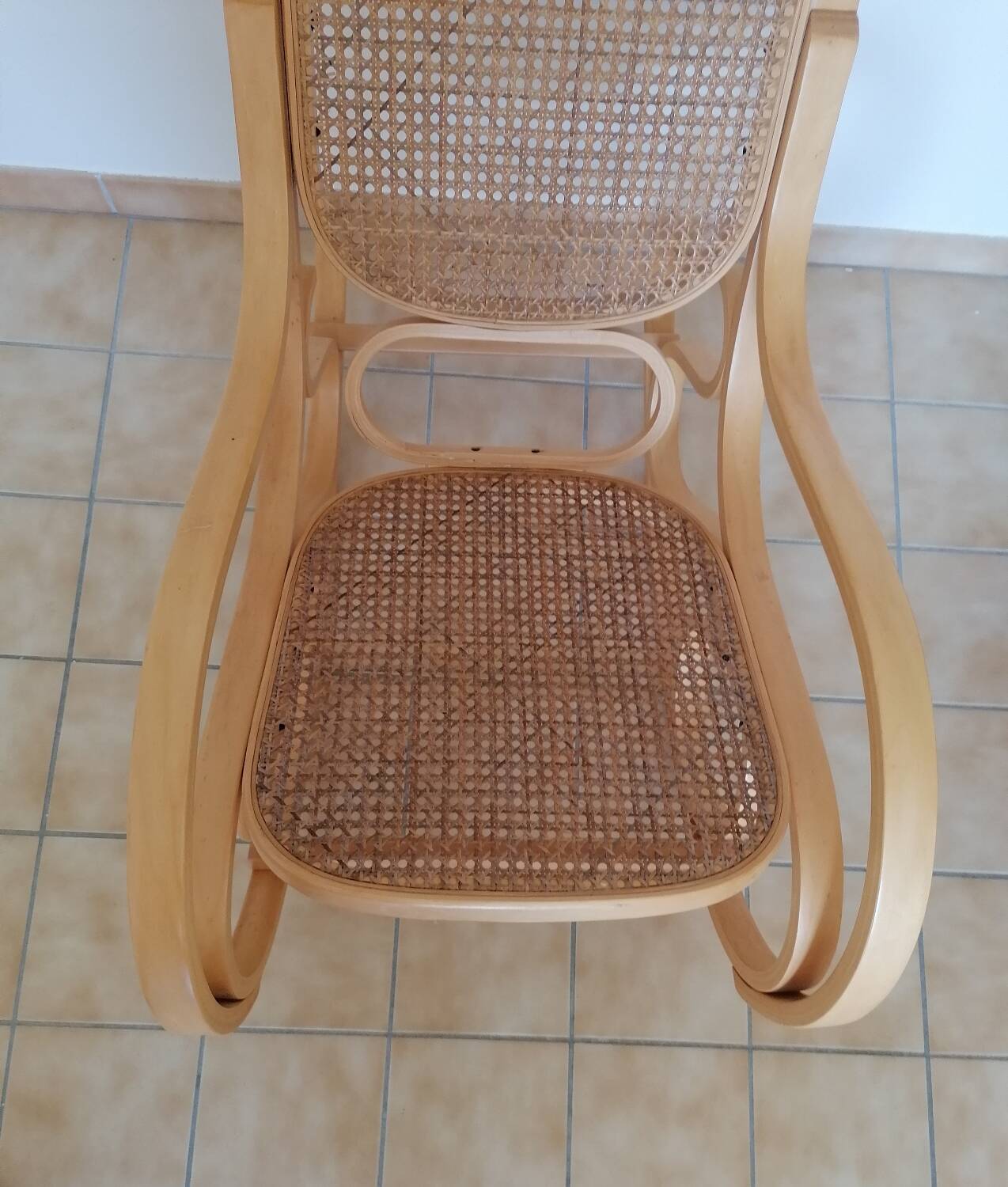 Wooden and cane rocking chair