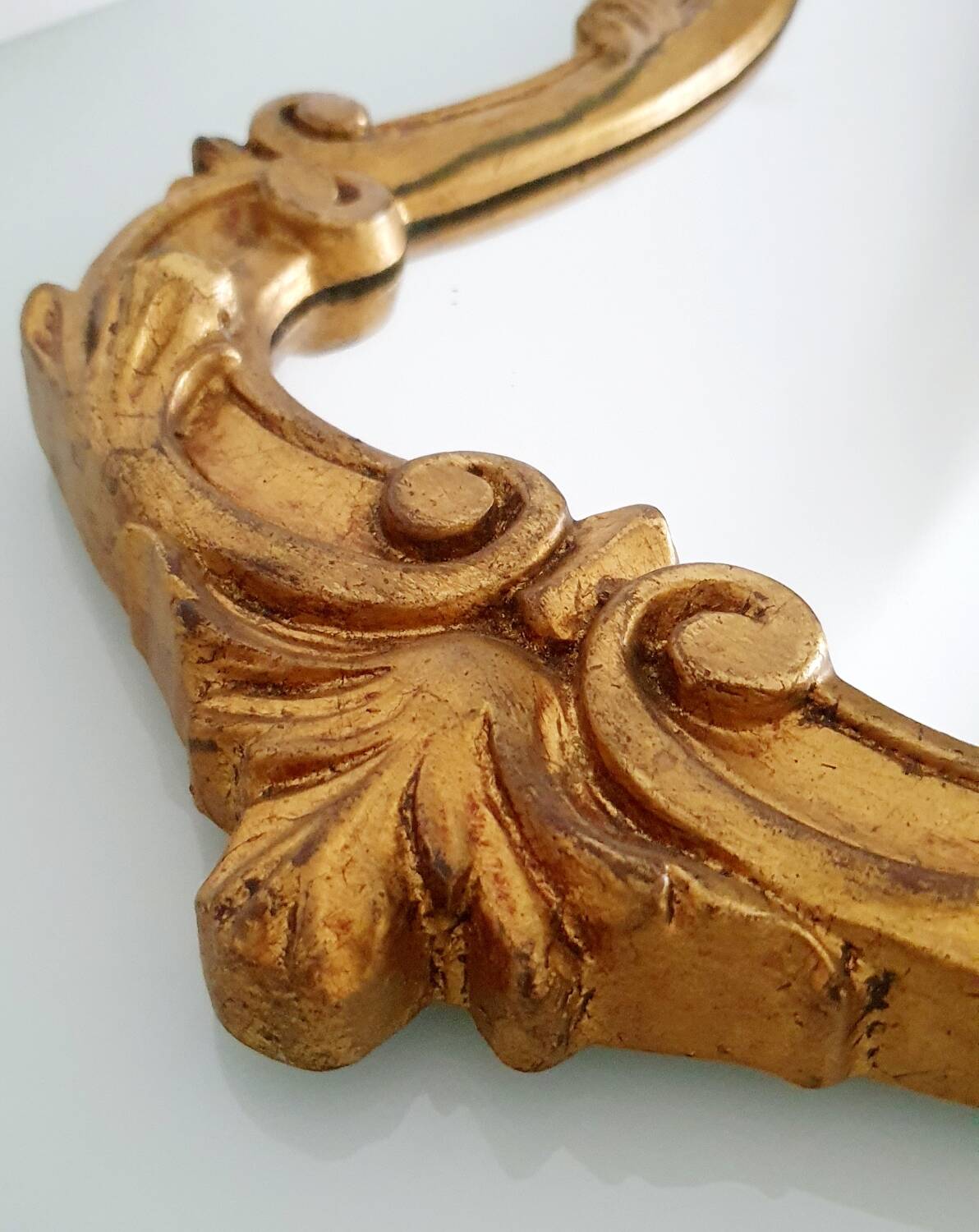 Baroque mirror gilded with gold leaf