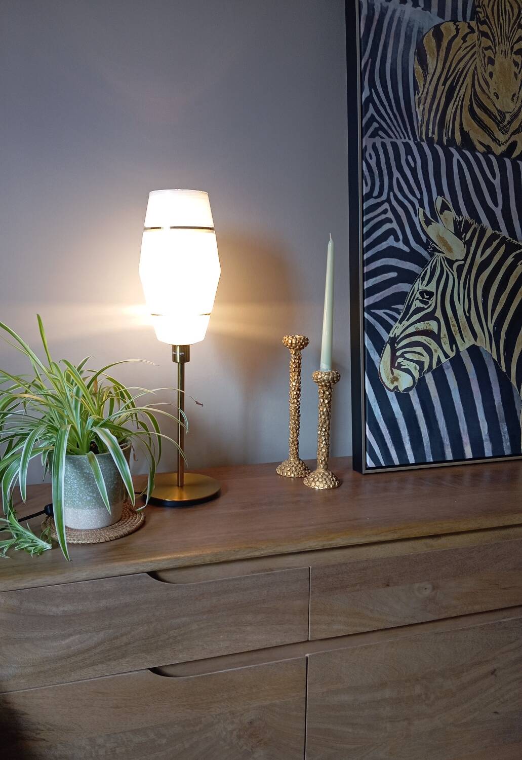 Mid-century gold metal table lamp with white striped shade