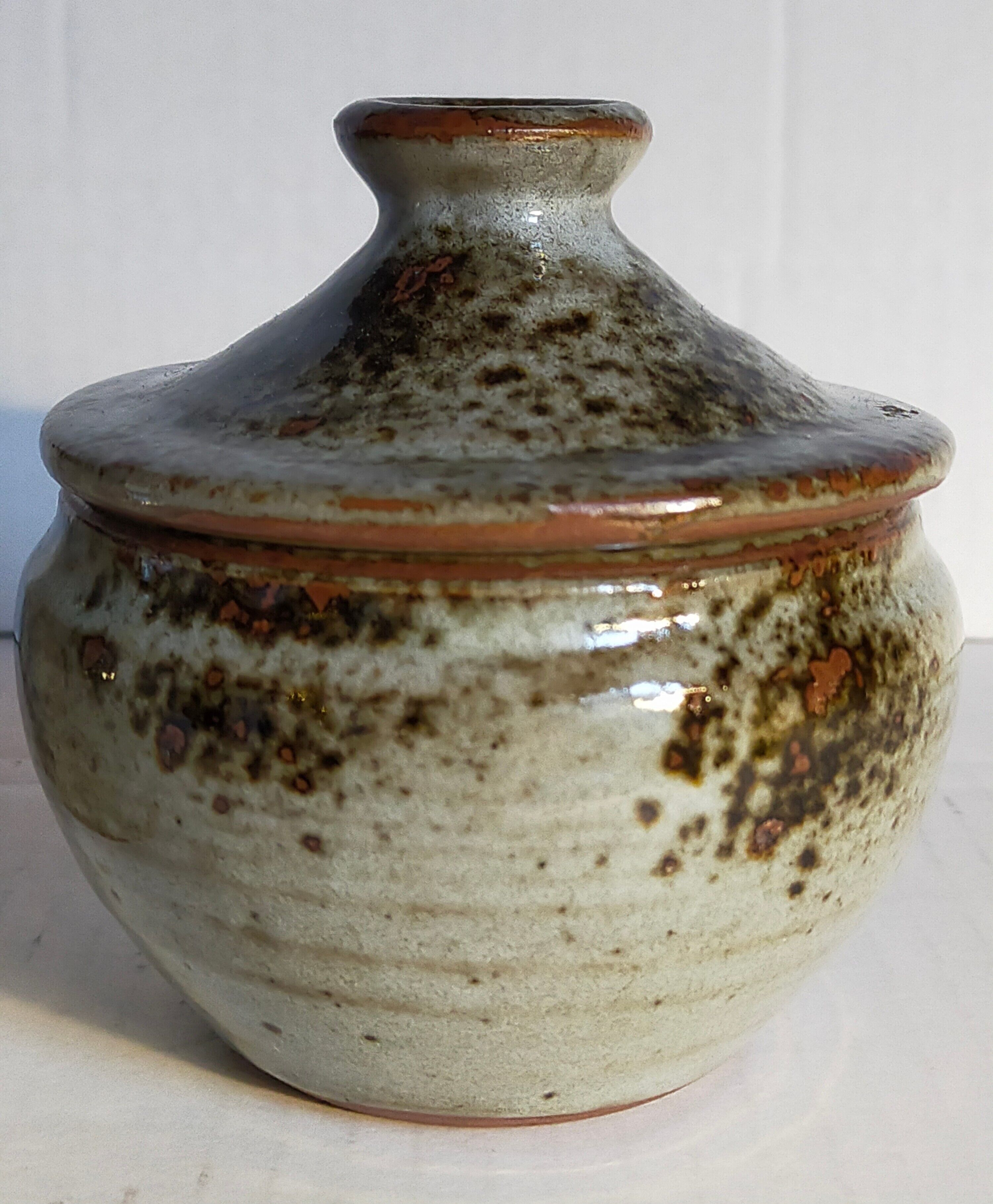 Duo of potter's pots covered in vintage glazed stoneware