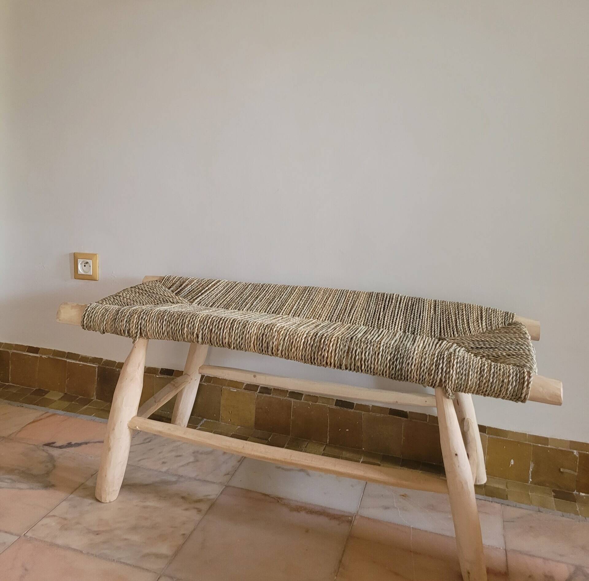 Eucalyptus wood bench and braided doum.