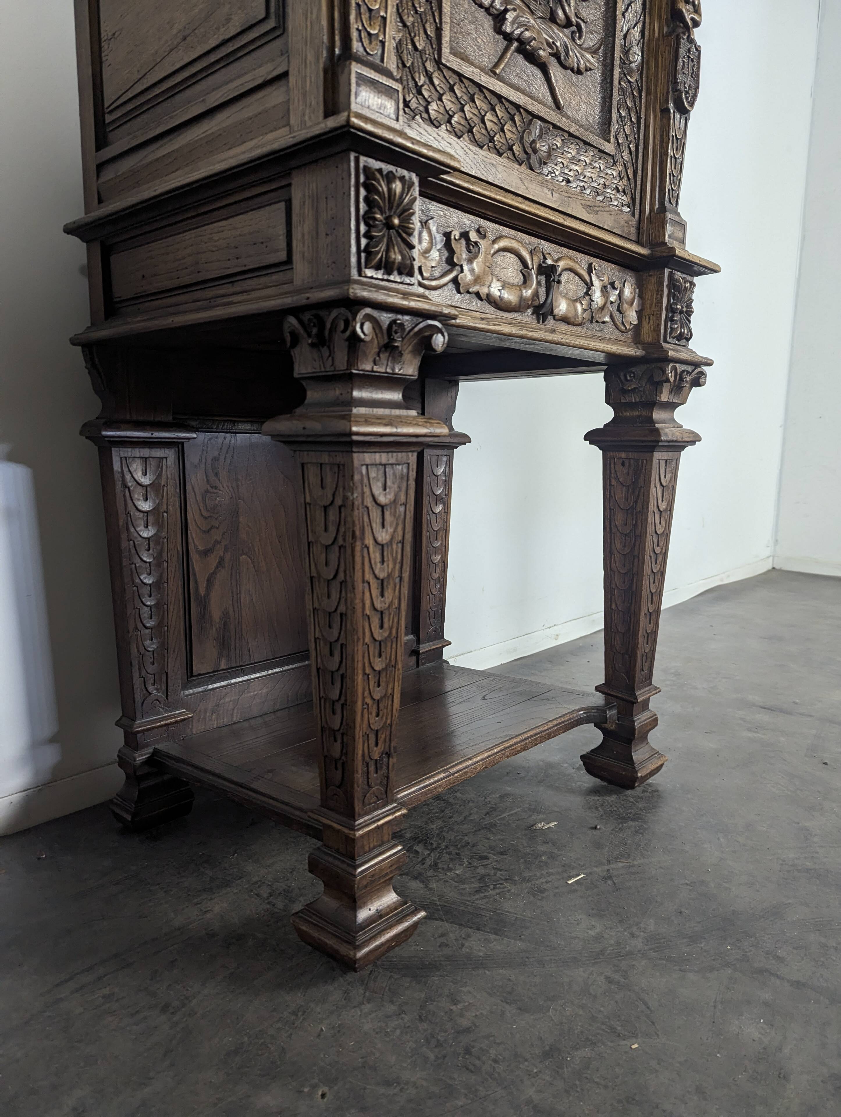 Renaissance-style cabinet in solid oak decorated with chimeras and caryatids