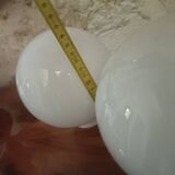 Pair of spherical lampshades in opaline.