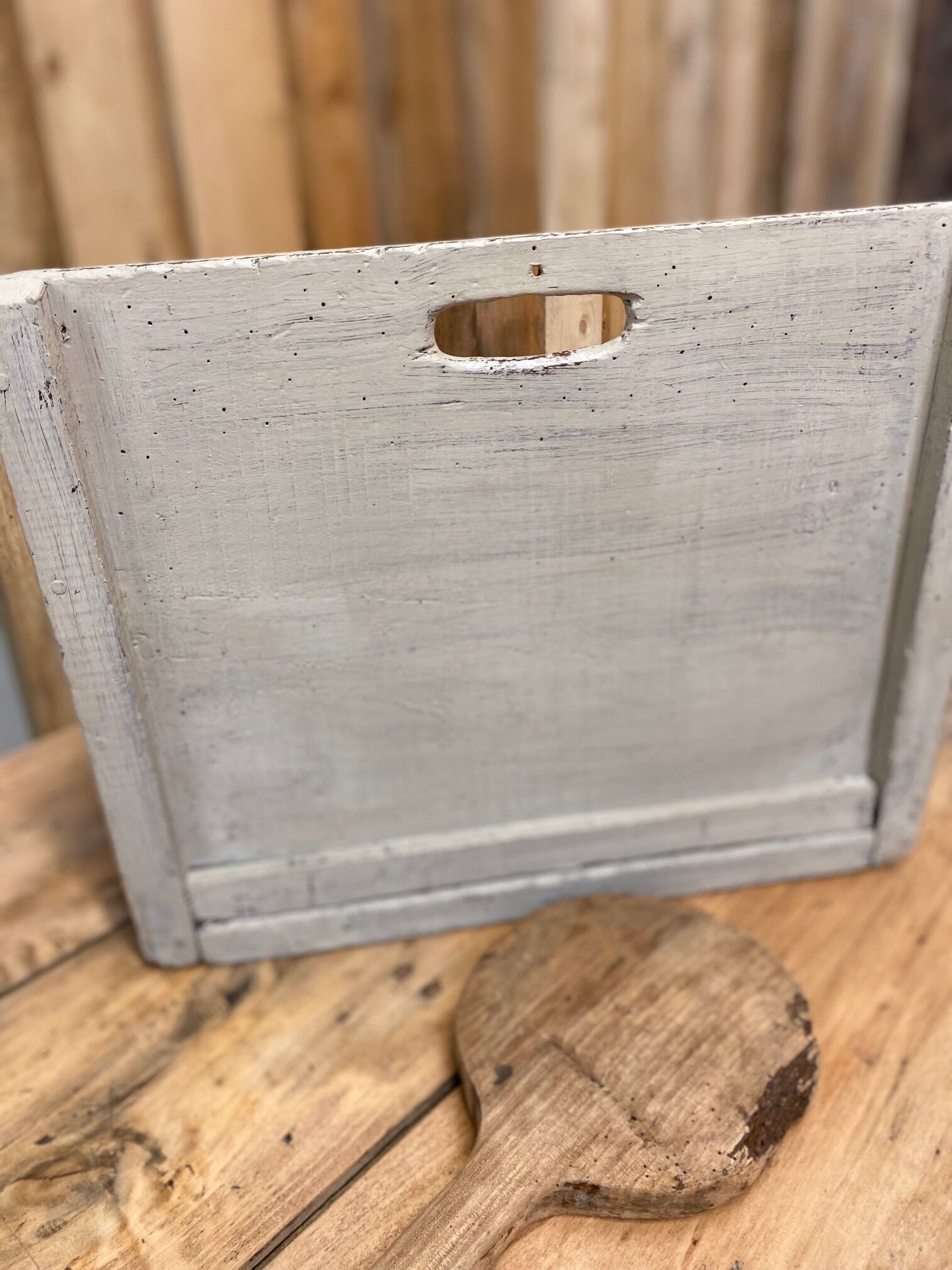 Old patinated washerwoman tray and its beater