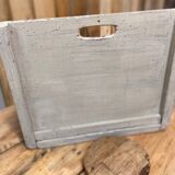 Old patinated washerwoman tray and its beater