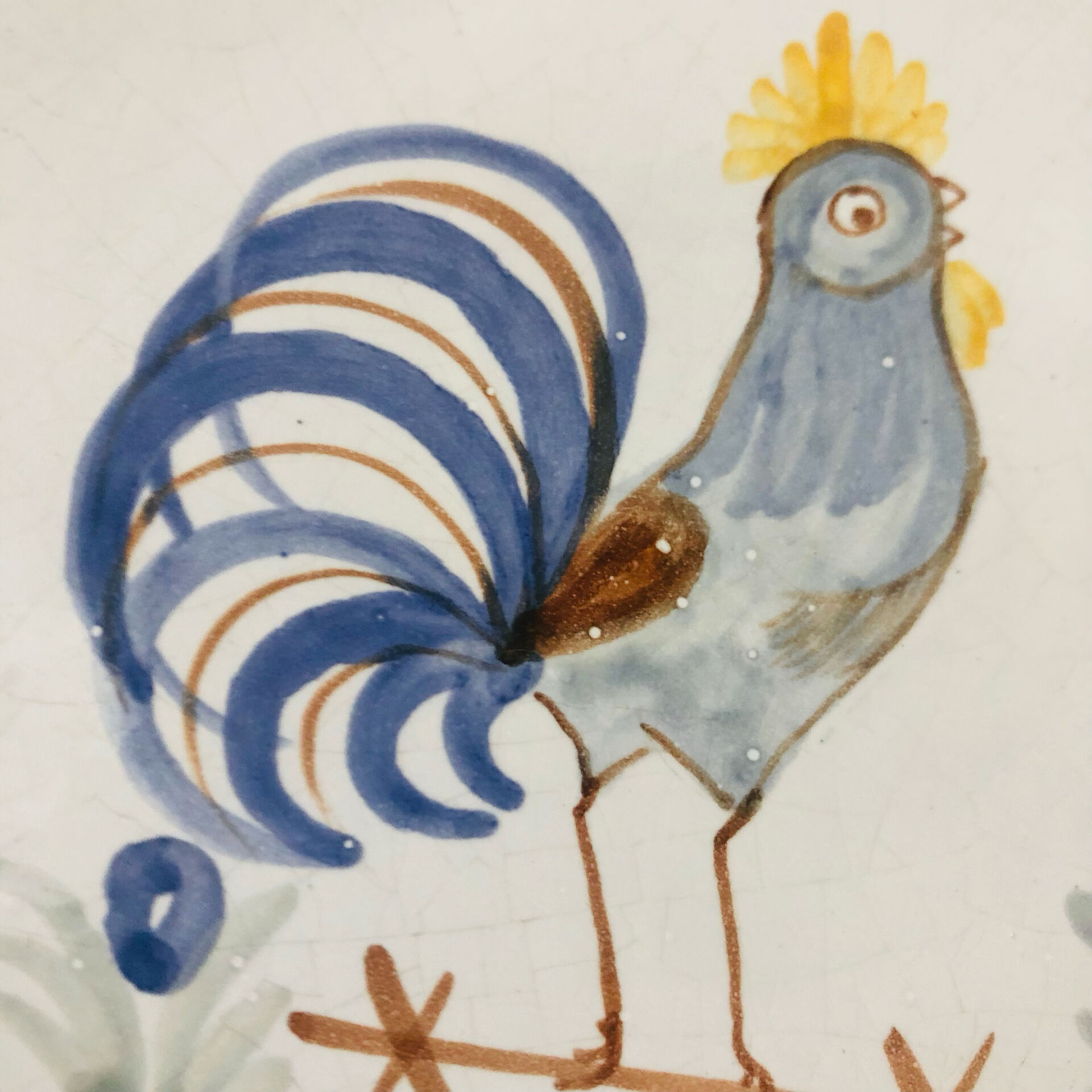 Pair of plates with naive Eastern rooster decoration