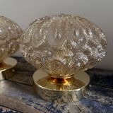 Set of two vintage amber glass wall lights