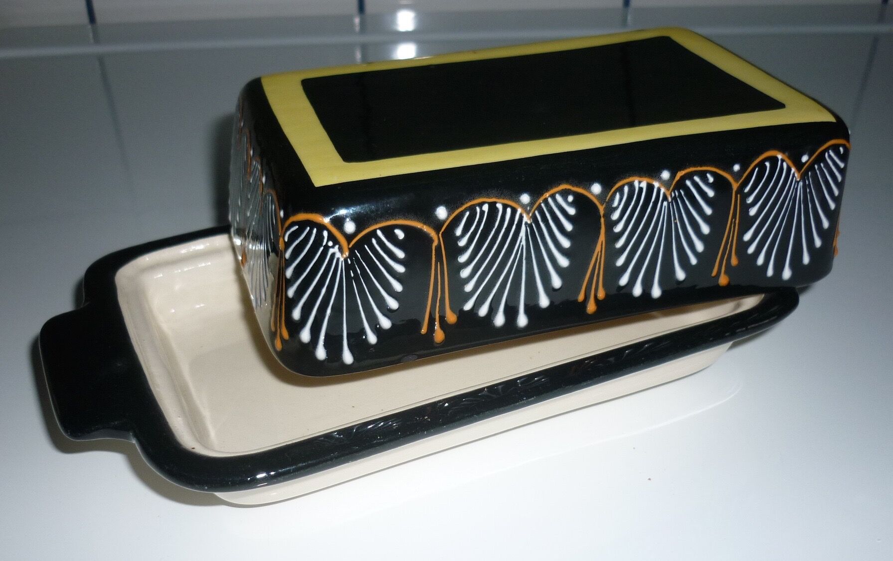 Butter dish with its black lid signed HB