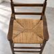 High chair made of straw and wood