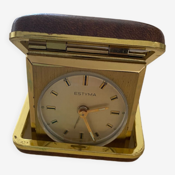 Travel alarm clock in its ransomes leather case