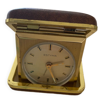 Travel alarm clock in its ransomes leather case