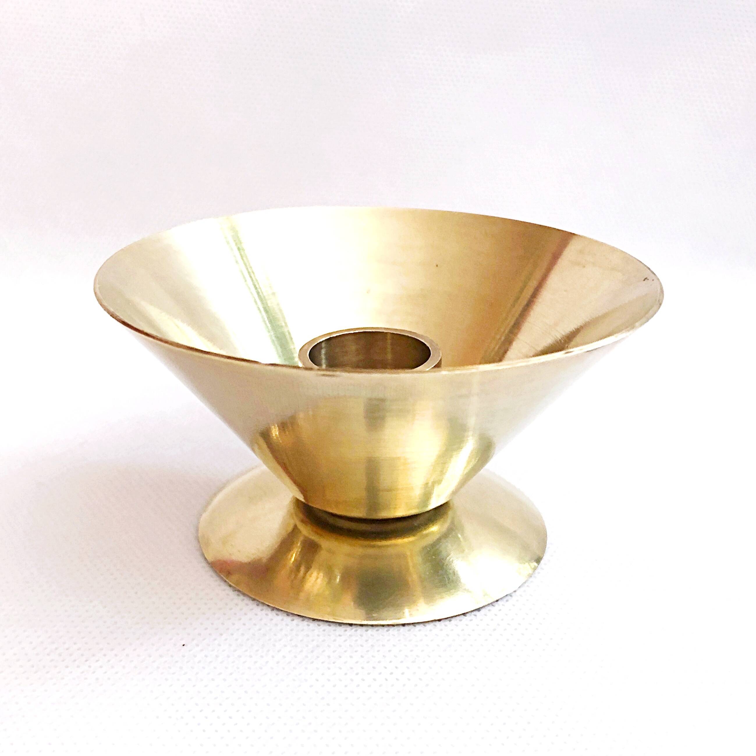 Table candle holder in golden brass