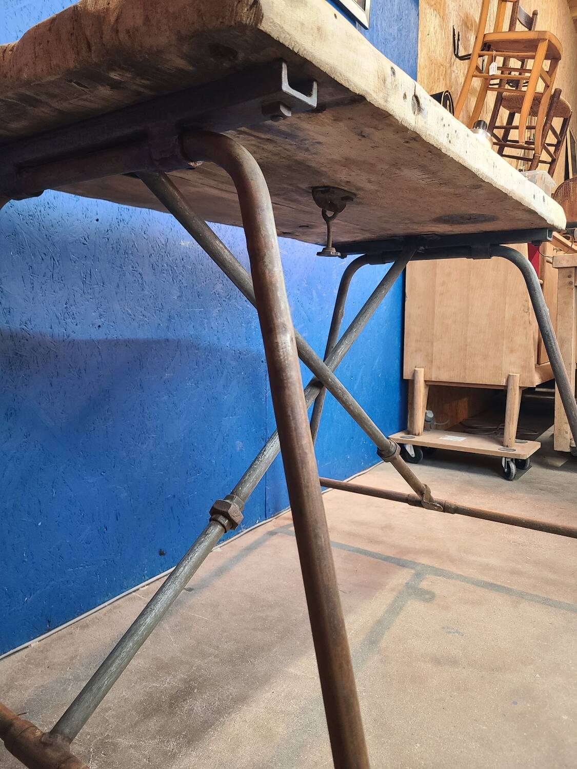 Vintage workbench circa 1930, folding metal leg.