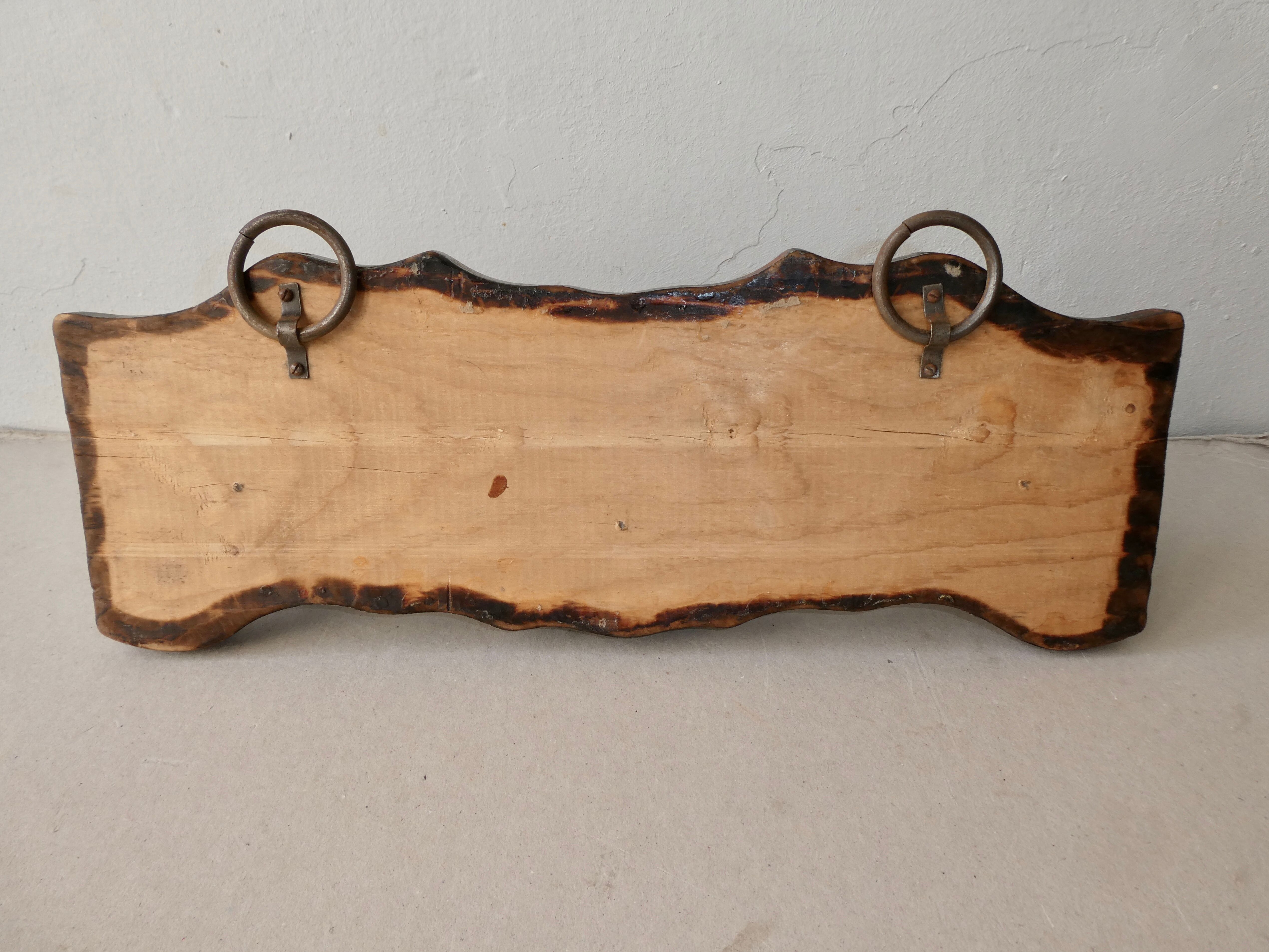 Wall hanger in burnt pine and cow skin