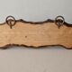 Wall hanger in burnt pine and cow skin