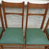 6 modern chairs with banded backs and green faux leather seats