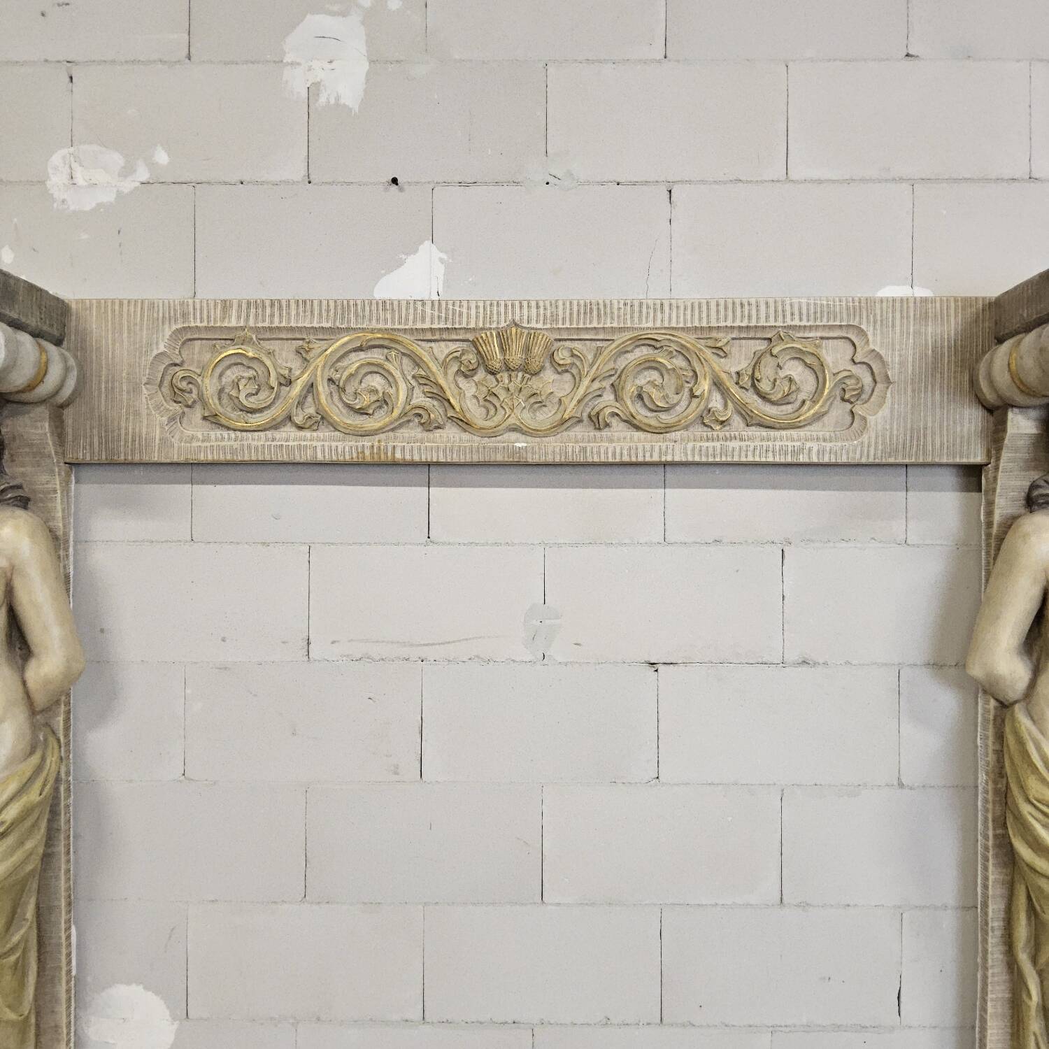Neoclassical plaster fireplace with caryatids (nude women)