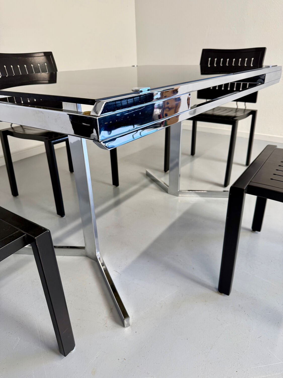 Smoked glass dining table with chrome legs, 1970s design by Roche Bobois.