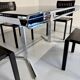Smoked glass dining table with chrome legs, 1970s design by Roche Bobois.