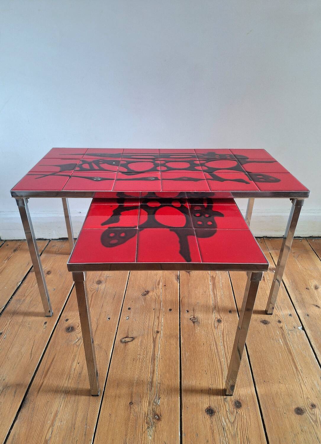 Pair of nesting coffee tables, vintage ceramic furniture.
