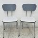 Set of two vintage grey Formica and chrome chairs.