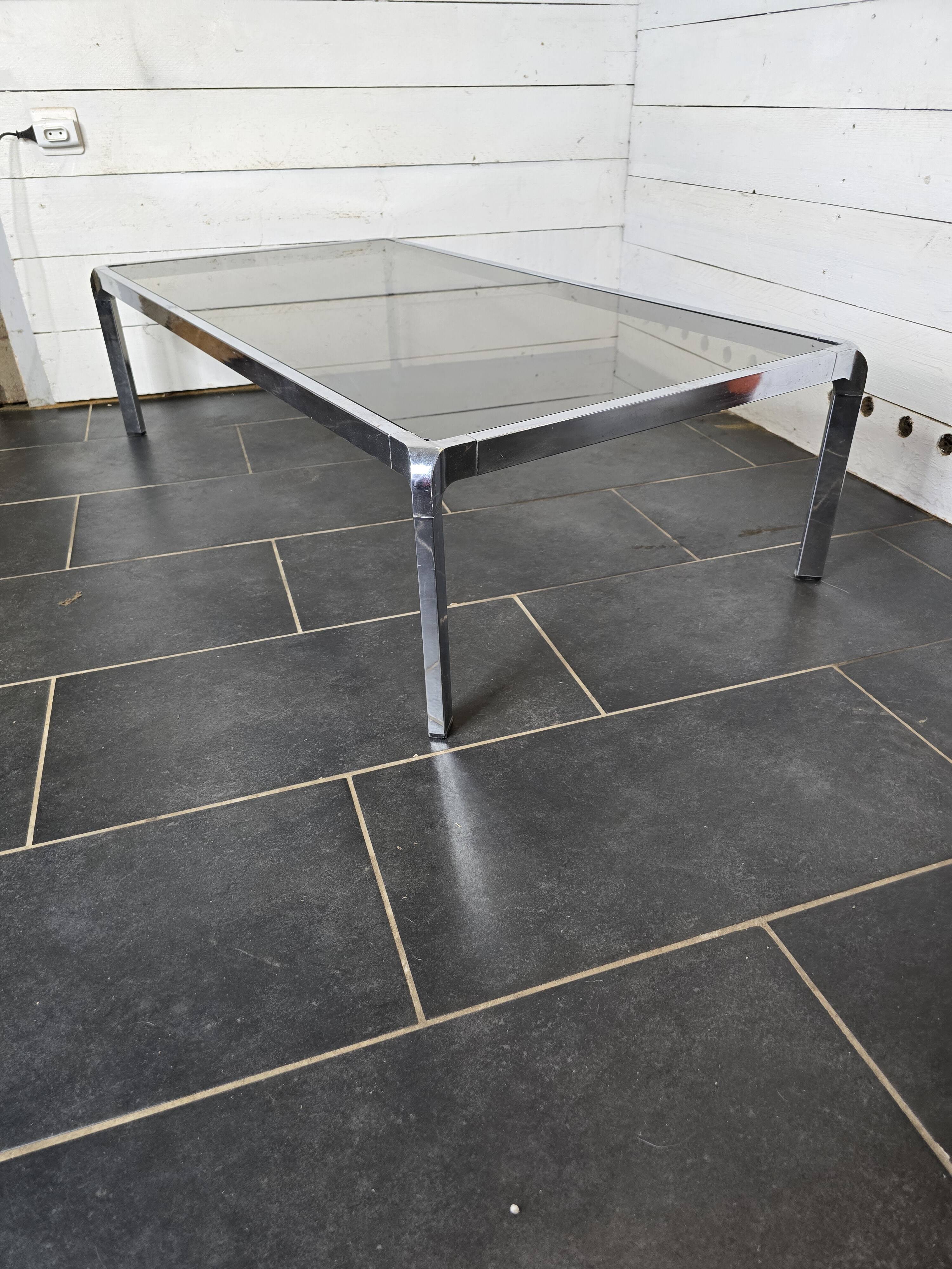 Chromed metal coffee table with smoked glass top from the 70s