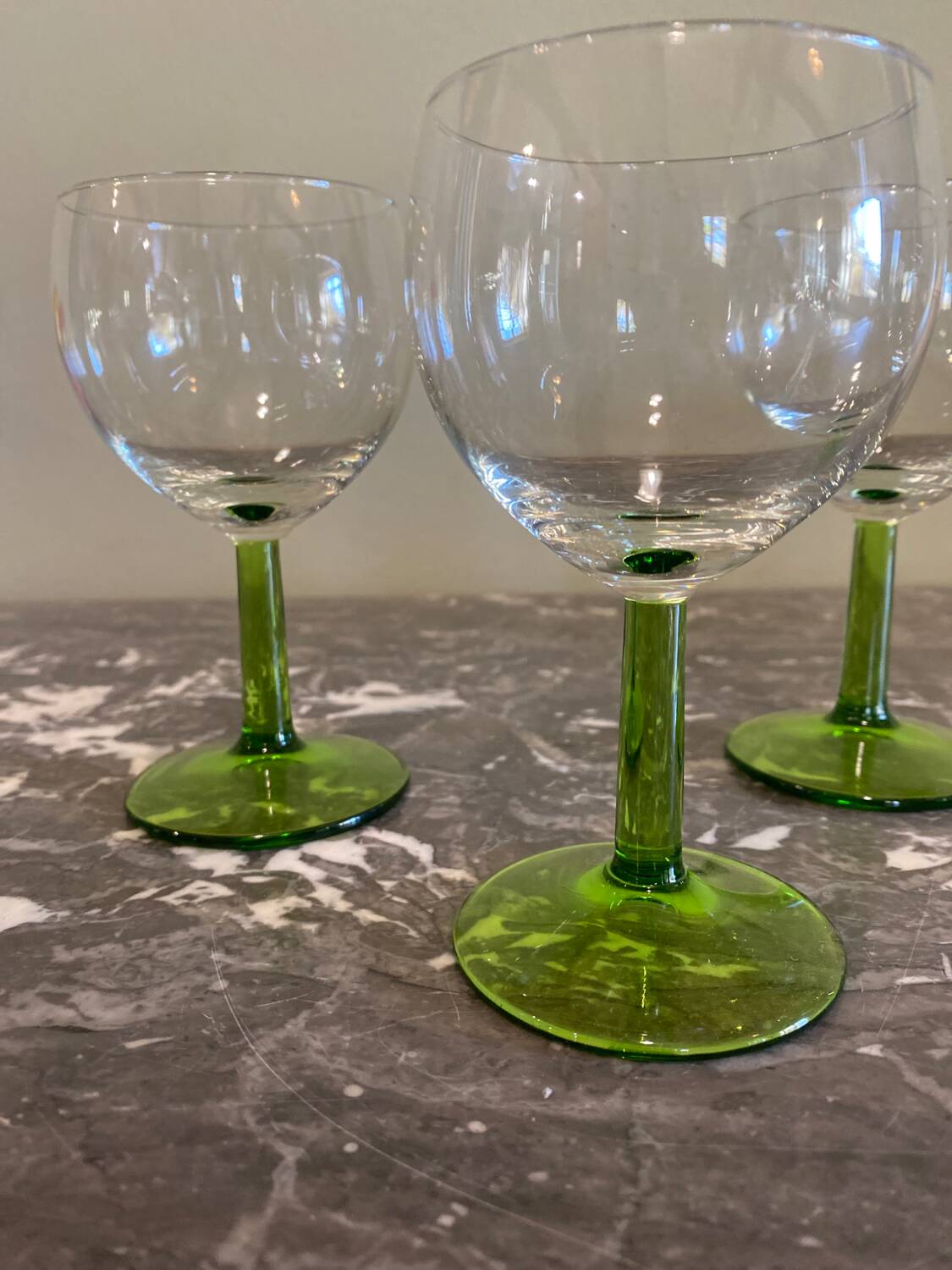 4 green stemmed glasses