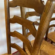 Set of 5 antique solid oak chairs with straw seats.