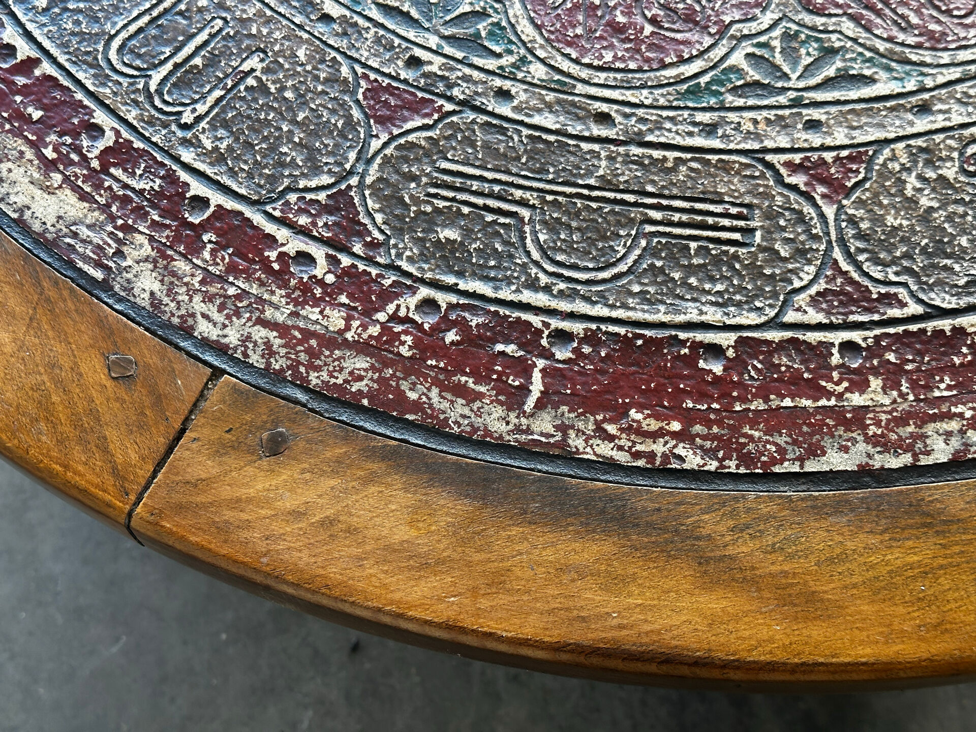 Vintage coffee table in turned wood and leather with astrological decoration.