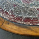 Vintage coffee table in turned wood and leather with astrological decoration.