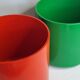 Pair of vintage paper baskets "Crayonne" in ABS, orange and green