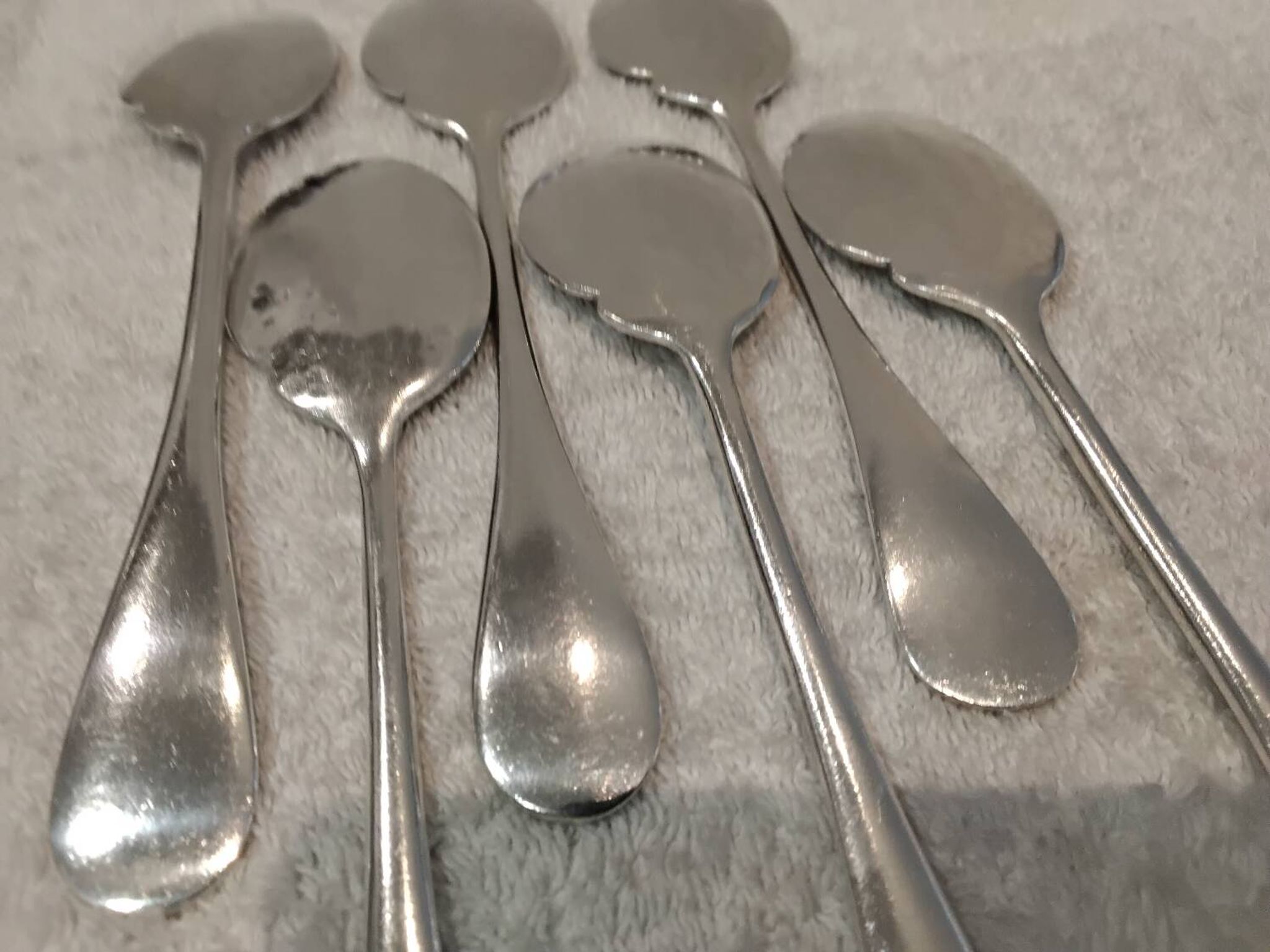 6 individual silver-plated metal sauce spoons with hammered baguette handles