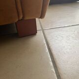 Brown leather club armchairs with an antique finish.