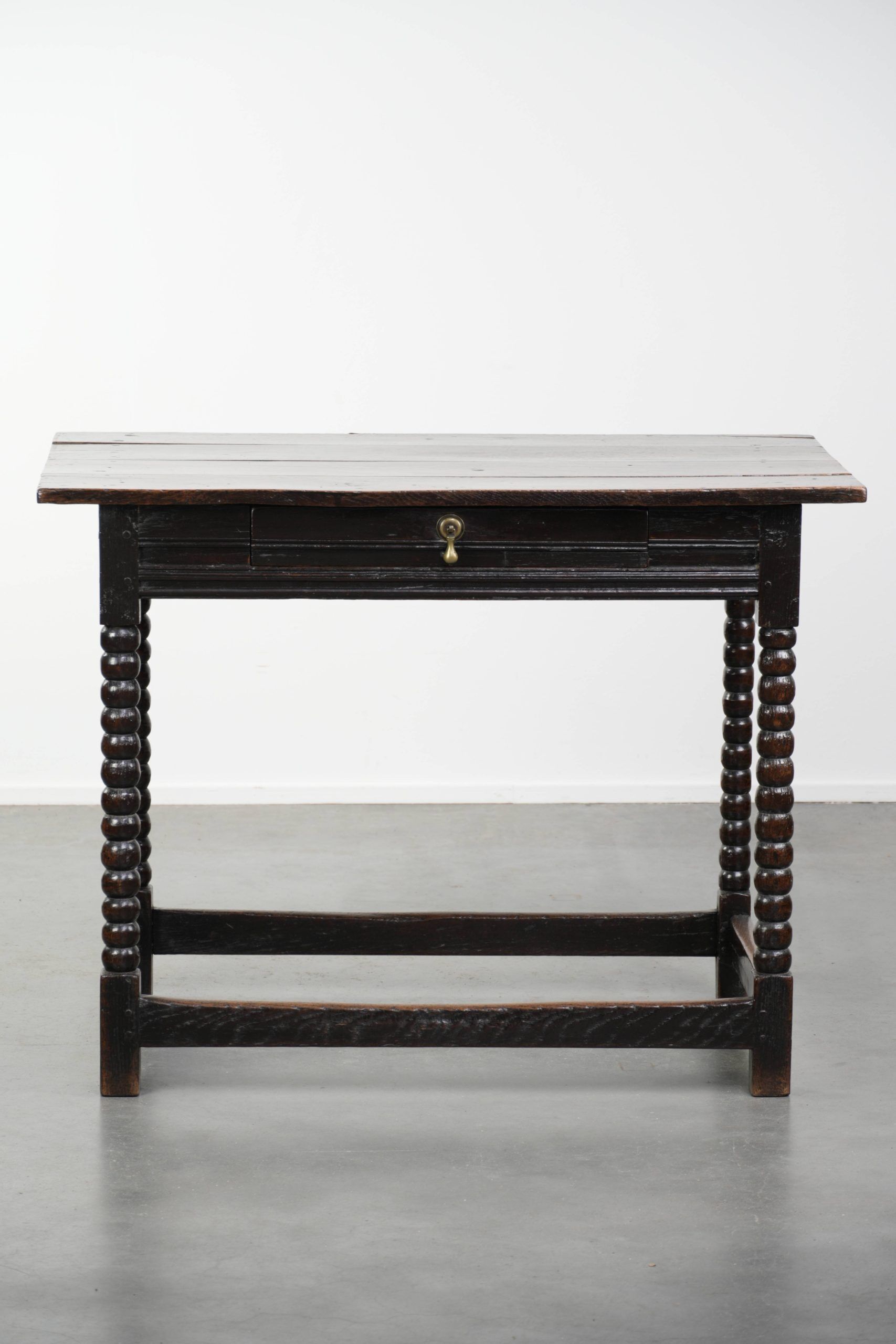 Antique English oak side table from the 18th century with bobbin legs