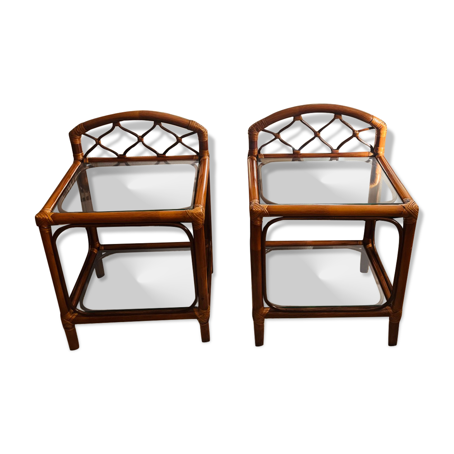 Two rattan and glass bedside tables